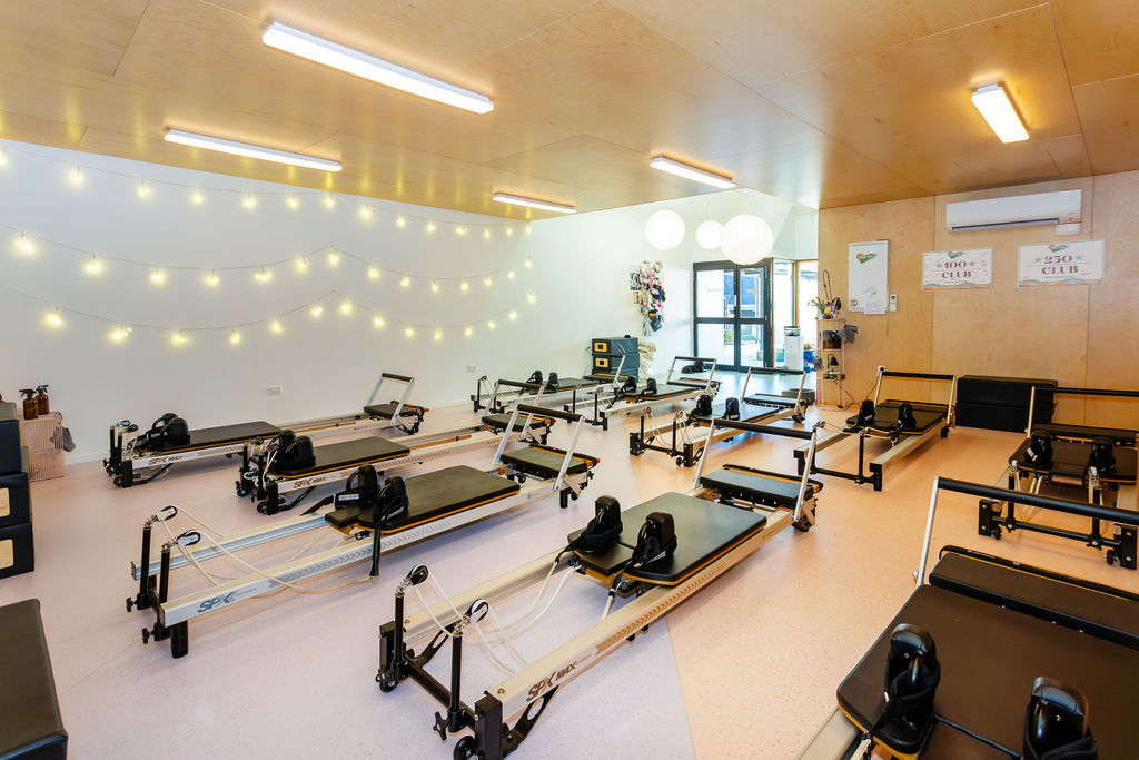 Sunlit boutique Pilates studio interior in Roslyn Village